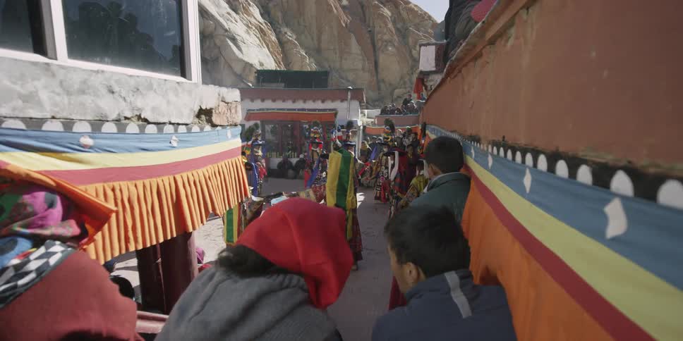 Many people are walking over to people performing
