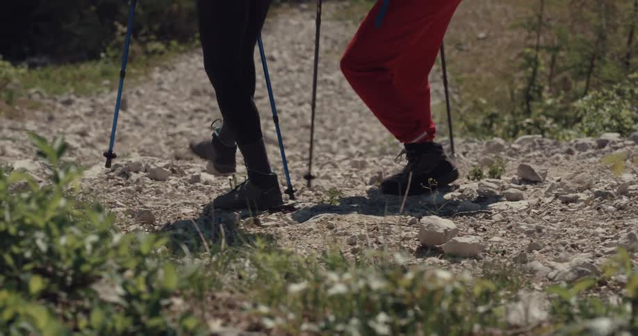 Two people hike down the hill