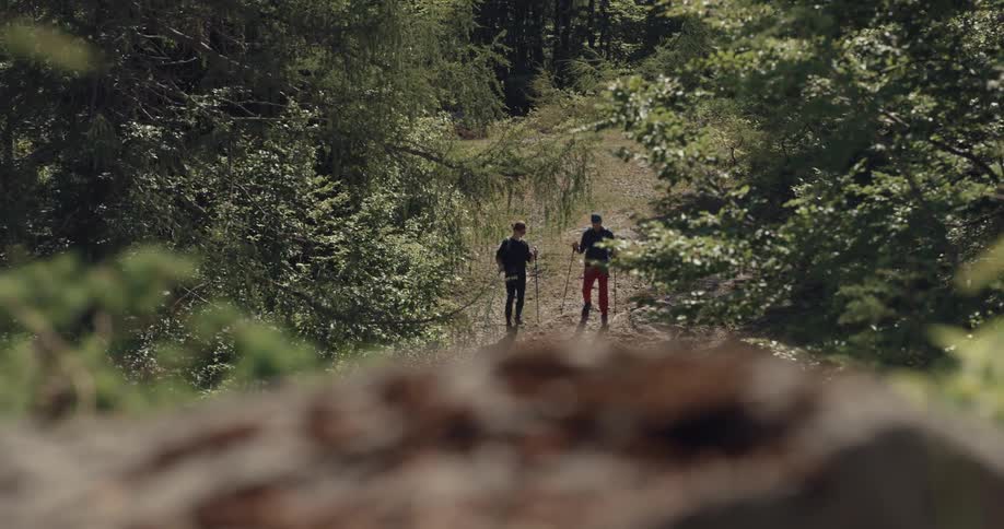 A man and woman hiking outdoors