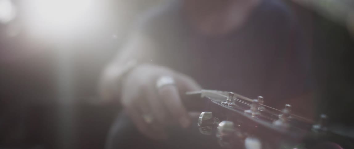 A man holding a guitar