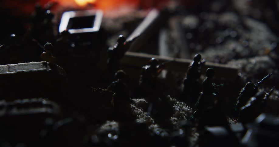 A view of toy soldiers outside next to a fire