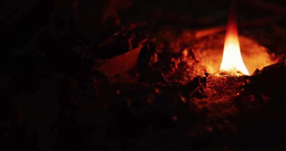 Toy soldiers surround a glowing flame