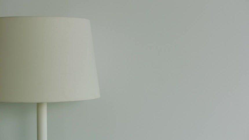 A view of a lamp sitting in a room