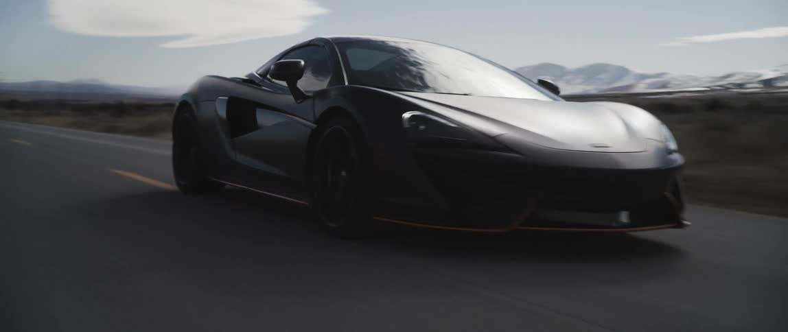 A car races down the highway