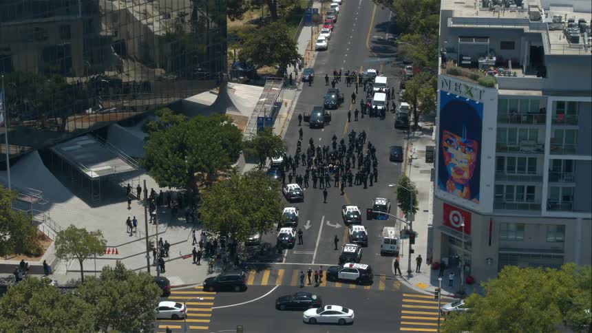 Traffic drives past the rally in the city