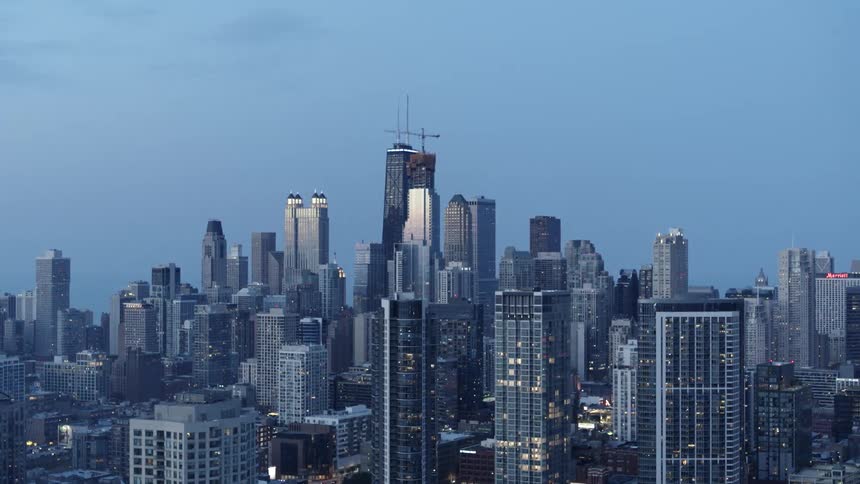 Aerial view of the tall skyscrapers on the city downtown at evening