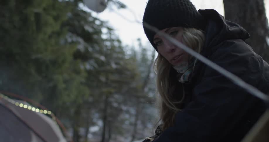 People roasting marshmallows on a cold day