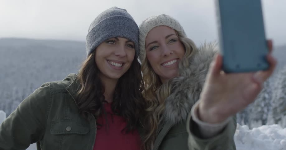Two women take a selfie out in nature