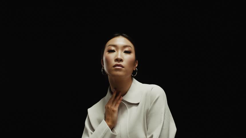 A woman standing and posing