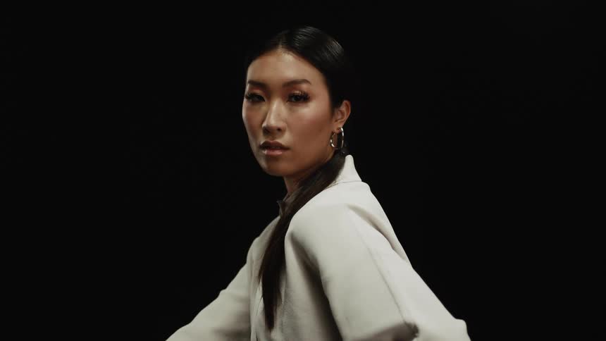 A model is posing while wearing all white