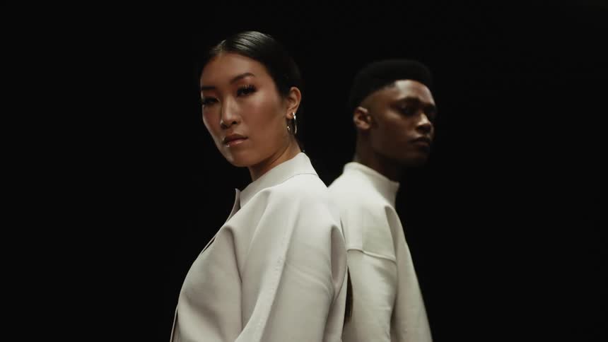 A man and woman are standing next to each other