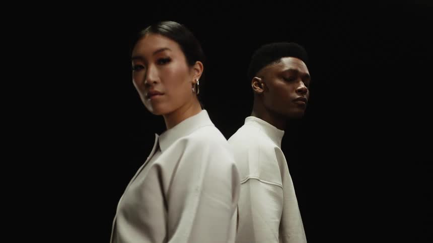 A man and woman are standing next to each other