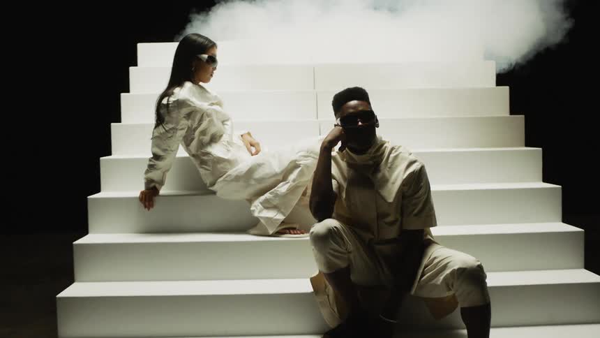 Man and woman are sitting on a staircase together
