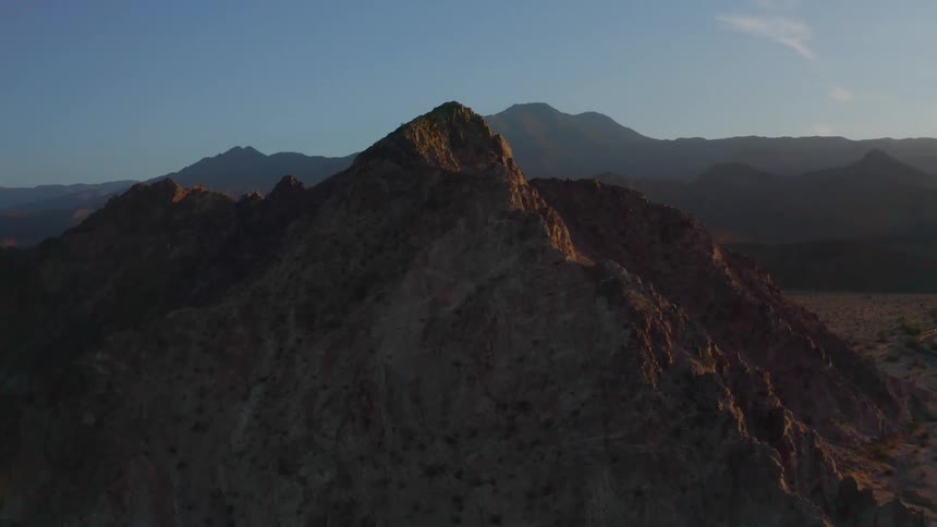 Mountains with peaks high in the blue sky