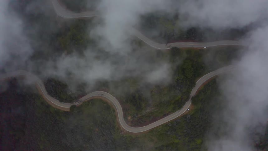Aerial view of a mountain road under the clouds