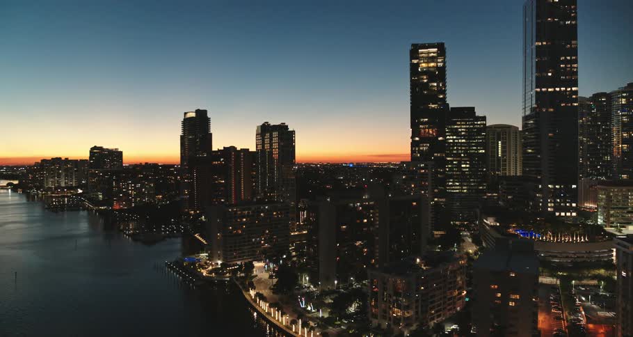 Skyscrapers on the coast of a metropolis at sunset