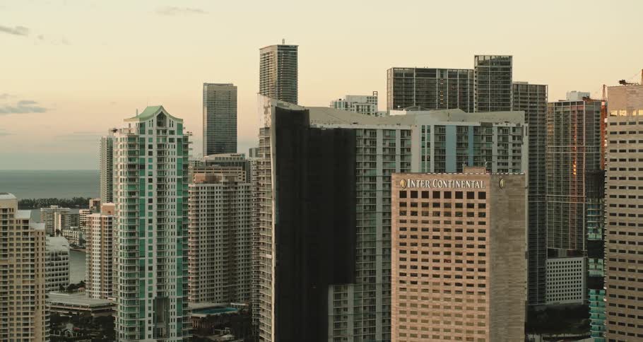 Aerial view of tall skyscrapers on the city skyline at sunset
