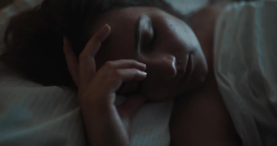 Woman lying in bed