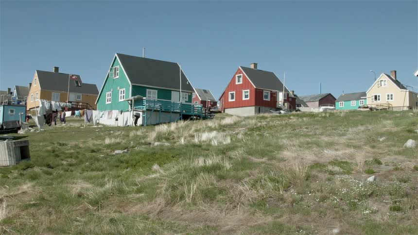 Small colorful houses with clothes drying in the wind on the clothesline