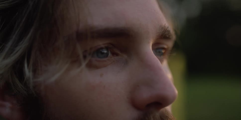 Man stares straight ahead and blink his eyes