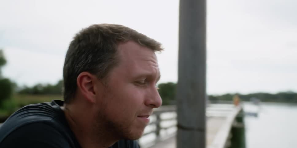 A man fishing off a pier
