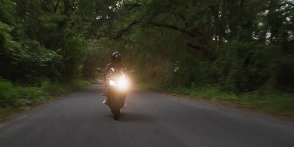 A person is riding their motorcycle on the road