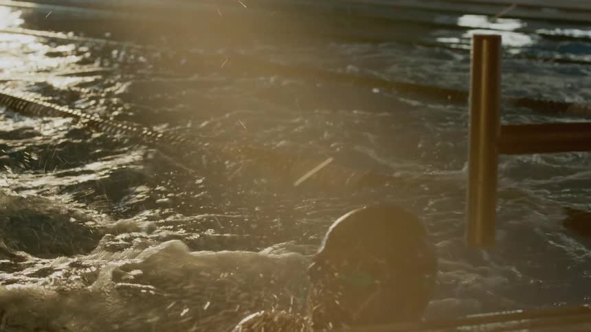 Swimmers racing in a pool