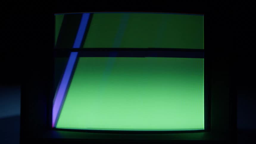 The television is flashing fast in the dark room