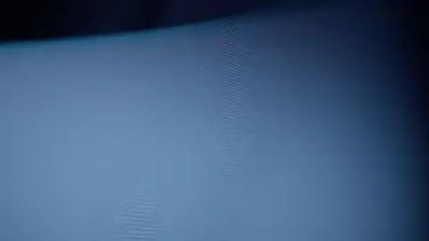 The television screen is flickering with static