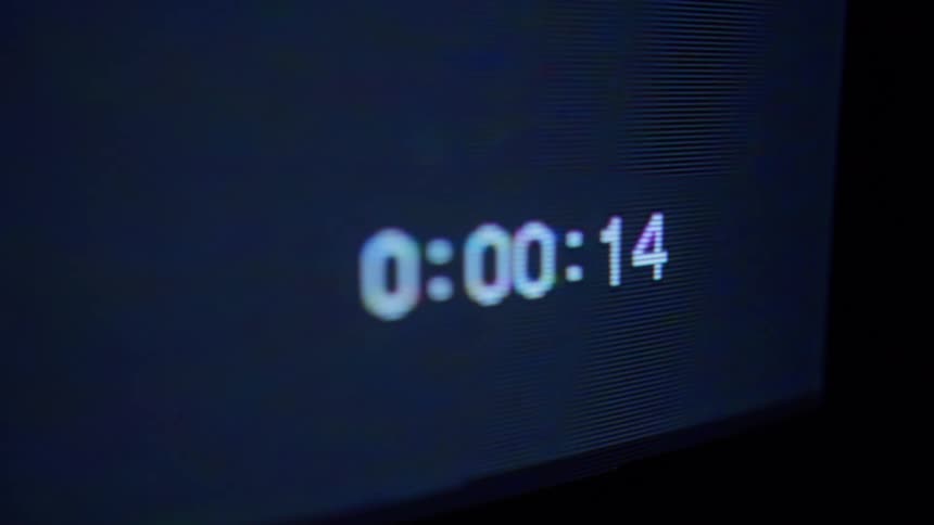 A clock changes on a screen