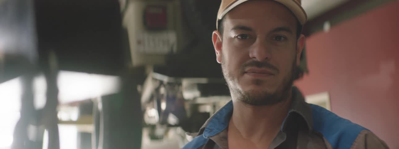 A mechanic posing