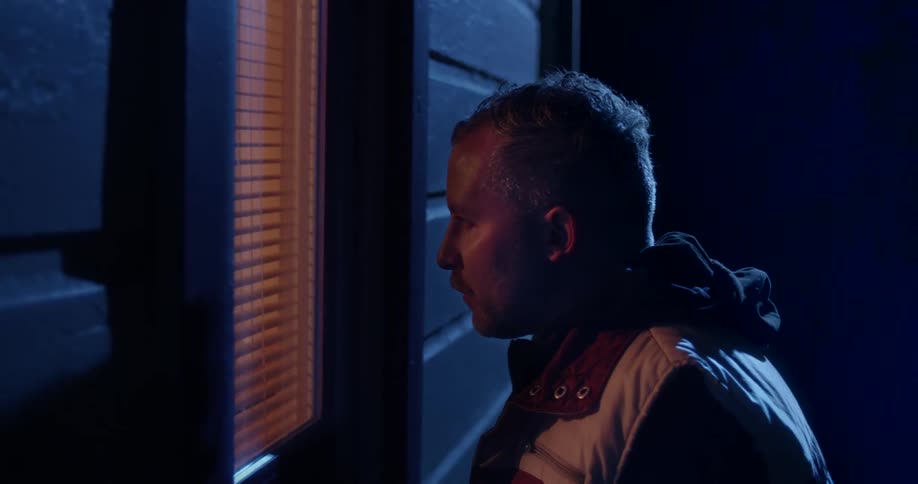 Person looking through a window