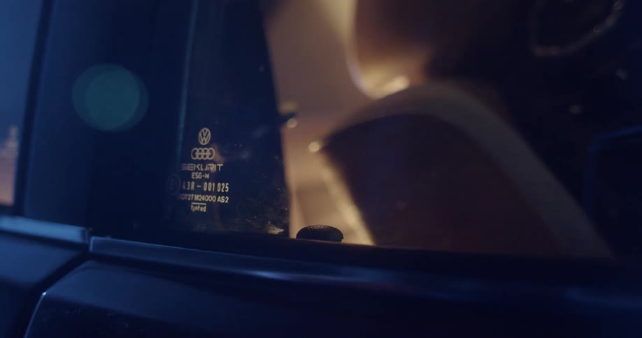 A person that is hitting a door lock on a vehicle