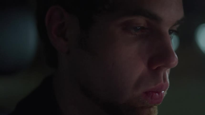 A close up view of a mans face is displayed