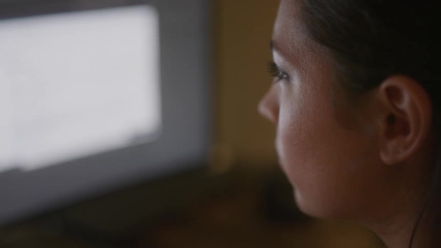 A woman uses a software program on her computer