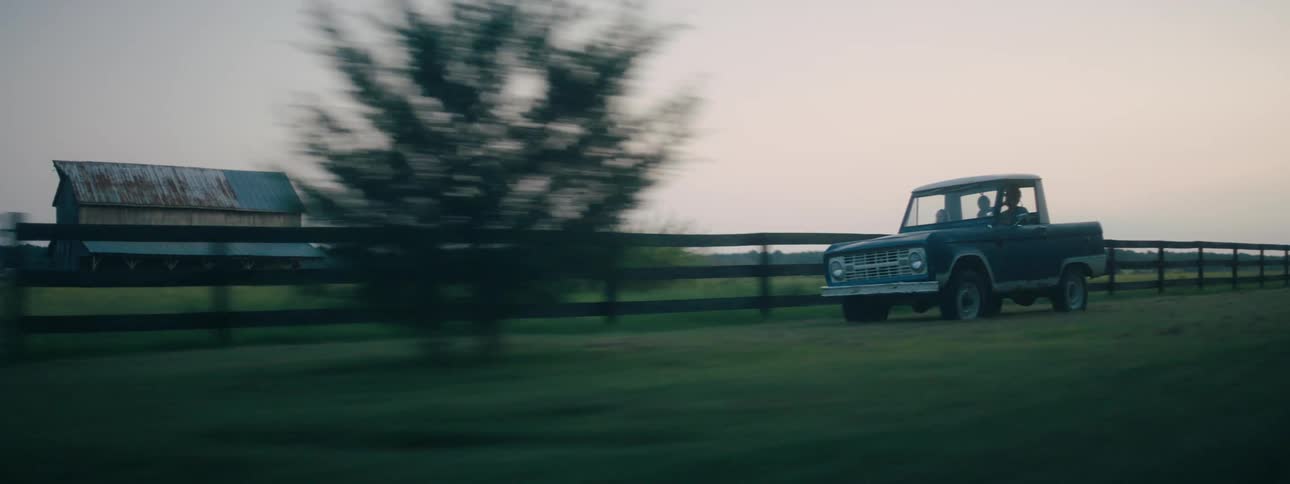 A truck driving on the grass