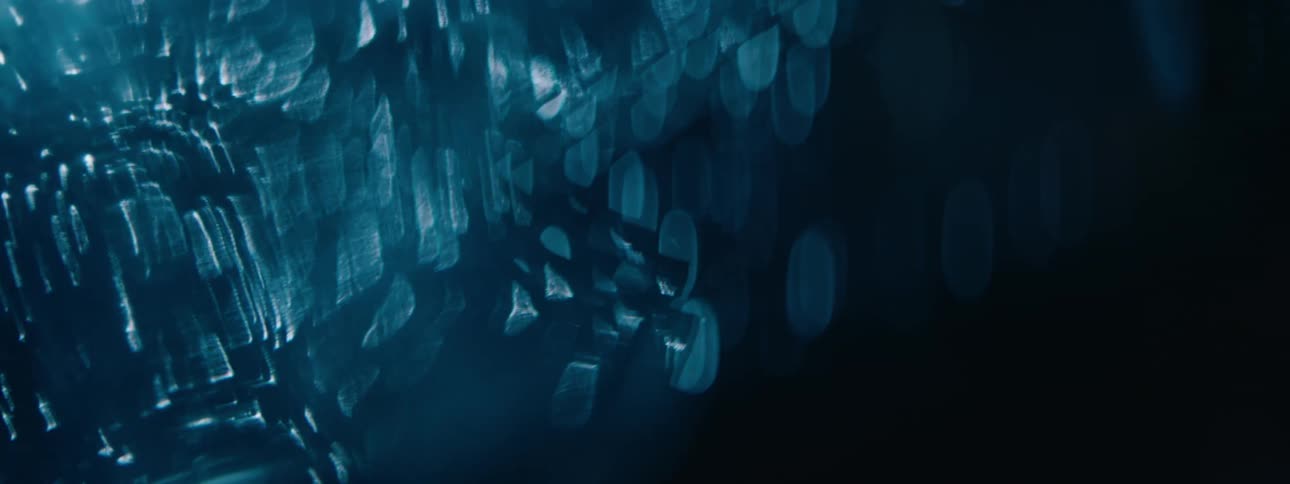 Water droplets on a reflective surface