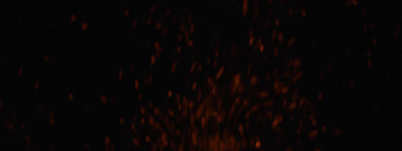 A view of a campfire burning at night