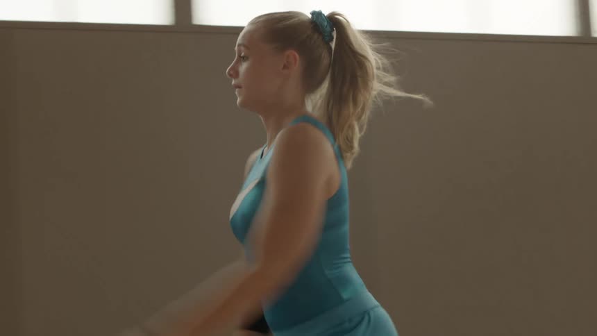A young girl doing gymnastics