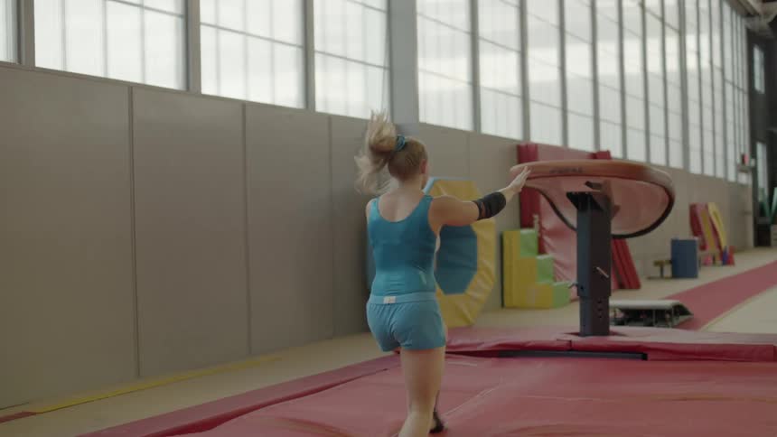 Woman running and vaulting