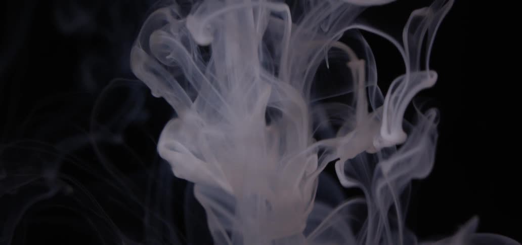 Smoke fills a dark area
