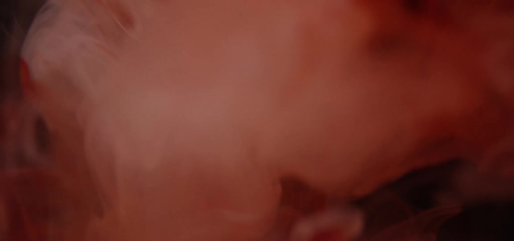 Dyed liquid descends into clear liquid