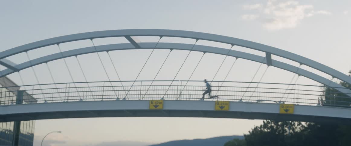 A man races across an overpass