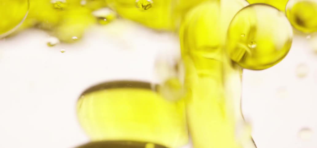 Yellow liquid in a white background