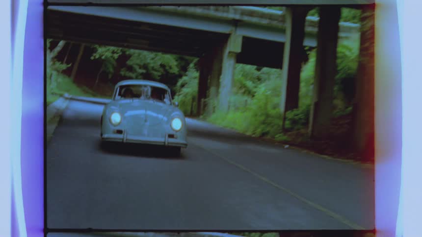 A car is moving down a winding road
