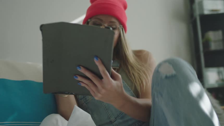 A woman drawing on a tablet computer