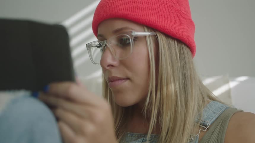 A woman drawing on a tablet