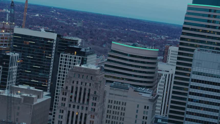 Tall skyscrapers loom over adjacent neighborhoods in the suburbs