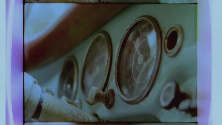 Close up of some dials in a moving car