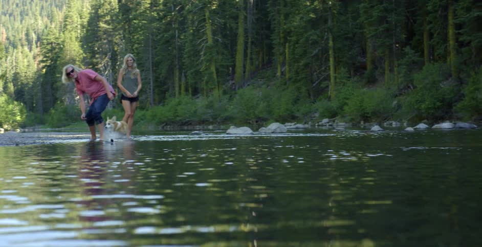 Man skips a rock across a lake